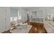 Bright living room boasts hardwood floors, neutral tones, sitting area, and seamless flow to the kitchen at 2315 Winthrop Ave, Charlotte, NC 28203