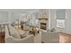 Bright living room seamlessly flowing into the dining area, featuring a cozy fireplace at 2315 Winthrop Ave, Charlotte, NC 28203
