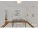 Well-lit office with large built-ins, hardwood floors, and an open doorway at 2315 Winthrop Ave, Charlotte, NC 28203