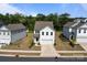 Aerial view of a well-maintained home with a manicured lawn and landscaping at 3127 Pinehills Way, Mount Holly, NC 28120