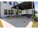 Covered patio with seating, fire pit, and backyard at 3127 Pinehills Way, Mount Holly, NC 28120