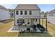 Home featuring a covered patio and a spacious backyard at 3127 Pinehills Way, Mount Holly, NC 28120