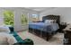 Spacious bedroom with a large bed, carpet, and lots of natural light at 3127 Pinehills Way, Mount Holly, NC 28120