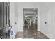 Bright foyer with hardwood floors and a view into the open-concept dining and living spaces at 3127 Pinehills Way, Mount Holly, NC 28120