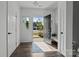Welcoming foyer featuring hardwood floors, bright natural light, and access to multiple rooms at 3127 Pinehills Way, Mount Holly, NC 28120