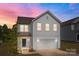 Well-maintained two-story home with a manicured lawn, a two car garage, and elegant landscaping at 3127 Pinehills Way, Mount Holly, NC 28120