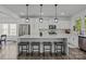 Modern kitchen featuring a center island with seating, stainless steel appliances, and ample counter space at 3127 Pinehills Way, Mount Holly, NC 28120
