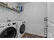 Functional laundry room with modern washer and dryer and ample storage space at 3127 Pinehills Way, Mount Holly, NC 28120