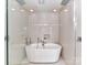 Spa-like bathroom with a freestanding tub, modern fixtures, and sleek tile work for a serene and luxurious experience at 314 Viburnum Way Ct, Charlotte, NC 28208