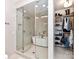 Luxurious bathroom featuring a glass-enclosed shower, soaking tub, and a walk-in closet for ultimate convenience at 314 Viburnum Way Ct, Charlotte, NC 28208