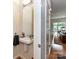 Modern powder room with pedestal sink and contemporary fixtures at 314 Viburnum Way Ct, Charlotte, NC 28208