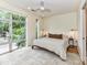 Sun-filled bedroom with a large window offering neighborhood views, complemented by a ceiling fan and soft, neutral decor at 314 Viburnum Way Ct, Charlotte, NC 28208