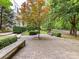 Picturesque courtyard with seating, a young maple, and meticulous landscaping creating a tranquil outdoor space at 314 Viburnum Way Ct, Charlotte, NC 28208