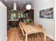 Bright dining area featuring a modern table, chairs, and view of kitchen at 314 Viburnum Way Ct, Charlotte, NC 28208