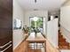 Bright dining room with a modern table, chairs, light fixture and sliding door to balcony at 314 Viburnum Way Ct, Charlotte, NC 28208