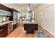 Modern kitchen featuring an island with cooktop, stainless steel appliances, and lots of counter space at 314 Viburnum Way Ct, Charlotte, NC 28208