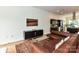 Modern living space with a leather sofa, open floor plan, and views into the kitchen at 314 Viburnum Way Ct, Charlotte, NC 28208