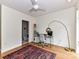 Well-lit home office featuring a modern desk, a large window, and direct access to an adjacent full bathroom at 314 Viburnum Way Ct, Charlotte, NC 28208