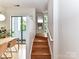 Hardwood staircase with natural light and access to an outdoor balcony at 314 Viburnum Way Ct, Charlotte, NC 28208
