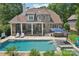 Aerial view of the backyard features a swimming pool, hot tub, outdoor seating and bar area at 3327 Lakeside Dr, Charlotte, NC 28270