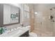 The bathroom features marble countertops, glass shower, toilet, and a large window at 3327 Lakeside Dr, Charlotte, NC 28270