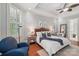 Spacious main bedroom with a ceiling fan, neutral walls, hardwood floors, and ample lighting at 3327 Lakeside Dr, Charlotte, NC 28270