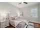 Light and bright bedroom with hardwood floors, overhead lighting, and a matching bedside table set at 3327 Lakeside Dr, Charlotte, NC 28270