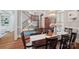 Formal dining room with hardwood floors, a chandelier, and staircase in view at 3327 Lakeside Dr, Charlotte, NC 28270