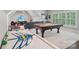 Spacious game room has a pool table, air hockey, television, and comfortable seating for entertainment at 3327 Lakeside Dr, Charlotte, NC 28270