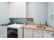 Functional laundry room with granite counters, sink, and white cabinets, for easy chores at 3327 Lakeside Dr, Charlotte, NC 28270