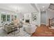 Bright and airy living room with fireplace, built-in bookshelves, and hardwood floors at 3327 Lakeside Dr, Charlotte, NC 28270