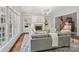 Spacious living room features a fireplace, built-in shelves, and large windows at 3327 Lakeside Dr, Charlotte, NC 28270