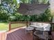 Outdoor deck with stylish seating, umbrella, providing a perfect spot for relaxation at 3530 Woodleaf Rd, Charlotte, NC 28205