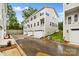 Exterior facade of modern townhomes featuring a two-car garage and neutral siding at 3916 Hager Dr, Charlotte, NC 28208