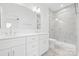 Modern bathroom features double sinks, a glass enclosed shower, and marble tile at 3924 Hager Dr, Charlotte, NC 28208