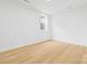 Bright bedroom with light wood floors and white walls has a window offering natural light at 3924 Hager Dr, Charlotte, NC 28208