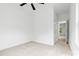 Bedroom showcasing carpet, ceiling fan, and a hallway to another room at 3924 Hager Dr, Charlotte, NC 28208