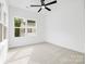 Bedroom featuring carpeted floors and a large window with a neighborhood view at 3924 Hager Dr, Charlotte, NC 28208