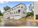 Modern townhouse exteriors with white siding, garages, and well-maintained landscaping at 3924 Hager Dr, Charlotte, NC 28208