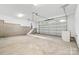 Spacious garage with concrete floors and white walls, ready for vehicles and storage at 3924 Hager Dr, Charlotte, NC 28208