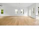 Spacious living room featuring hardwood floors, recessed lighting, and multiple windows at 3924 Hager Dr, Charlotte, NC 28208