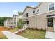 Modern townhome exterior with brick facade, manicured landscaping, and inviting entrance at 3928 Hager Dr, Charlotte, NC 28208