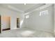 Bright, neutral bedroom with a tray ceiling, carpeted flooring, and multiple windows for natural light at 4051 Whittier Ln, Fort Mill, SC 29708