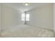 Spacious bedroom with large windows and neutral carpet at 4051 Whittier Ln, Fort Mill, SC 29708