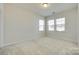 Bright bedroom with large windows and neutral carpet at 4051 Whittier Ln, Fort Mill, SC 29708