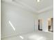 Spacious bedroom with neutral carpet, tray ceiling, and doorways leading to the bathroom and closet at 4051 Whittier Ln, Fort Mill, SC 29708