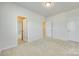 Spacious bedroom with large windows, walk-in closet, and neutral carpet at 4051 Whittier Ln, Fort Mill, SC 29708