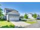 Charming two-story home with a two-car garage, complemented by a lush green lawn and vibrant landscaping at 4051 Whittier Ln, Fort Mill, SC 29708