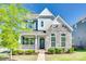 Inviting two-story home exterior boasting stone accents, manicured landscaping, and charming curb appeal at 4051 Whittier Ln, Fort Mill, SC 29708