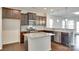 Well-equipped kitchen with granite countertops, stainless steel appliances, and ample storage space offers culinary delight at 4051 Whittier Ln, Fort Mill, SC 29708